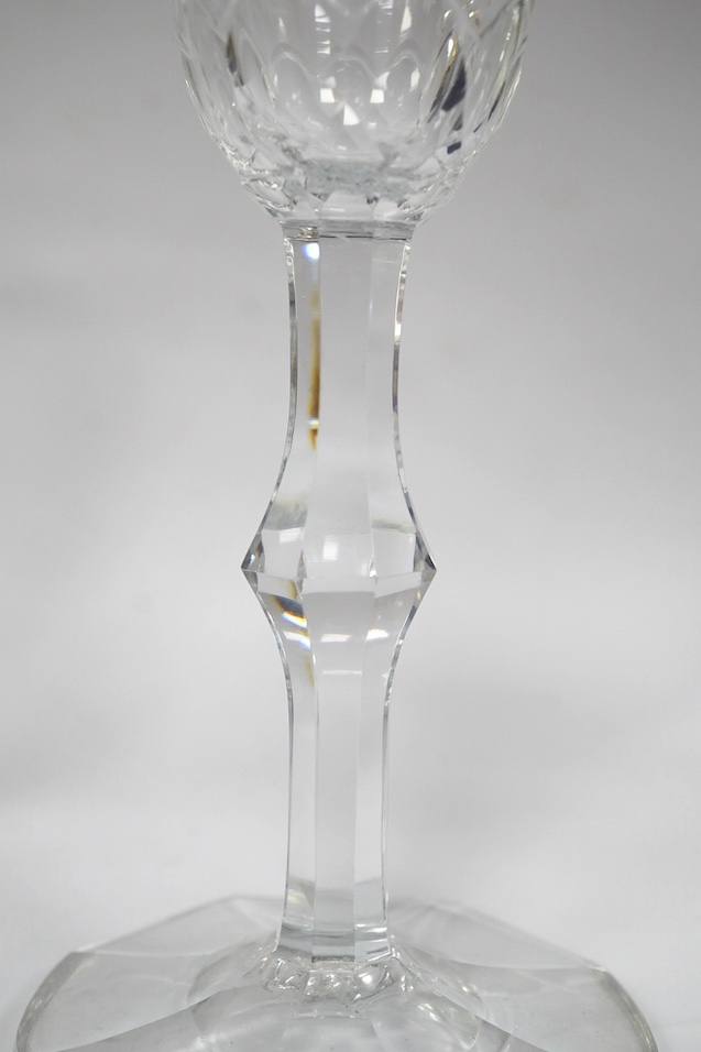 A DSOT stem goblet, circa 1765, with a cup shaped bowl, diamond point engraved ‘J Edden’and a facet stem wine glass, circa 1770, the round funnel bowl engraved with fruiting vines a chrysanthemum and a moth, 15.3cm and 1